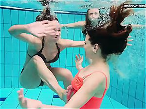3 naked femmes have fun underwater
